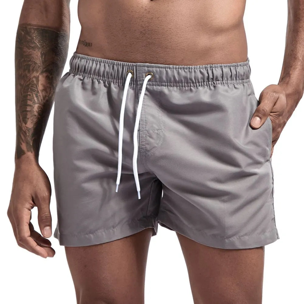 JOCKMAIL Men's Board Shorts Fast Dry 2020 Summer Holiday Beach Surf Pocket Swimming Trunks Sport Running Hybird Shorts